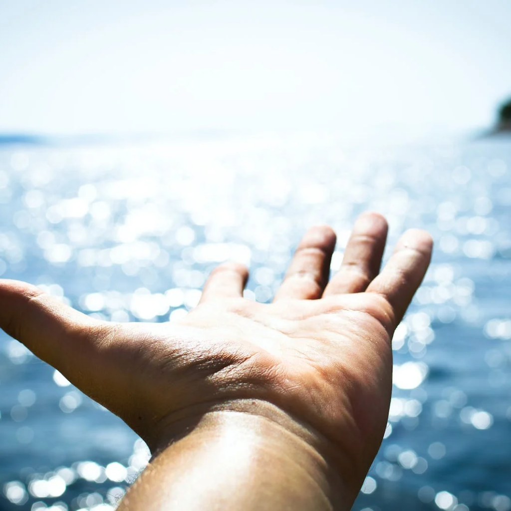 Christian Positive Affirmations  - Hand pointing to the ocean